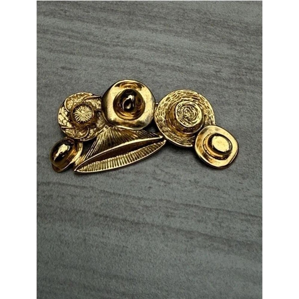 vintage MCM gold-tone multicultural traditional hat brooch